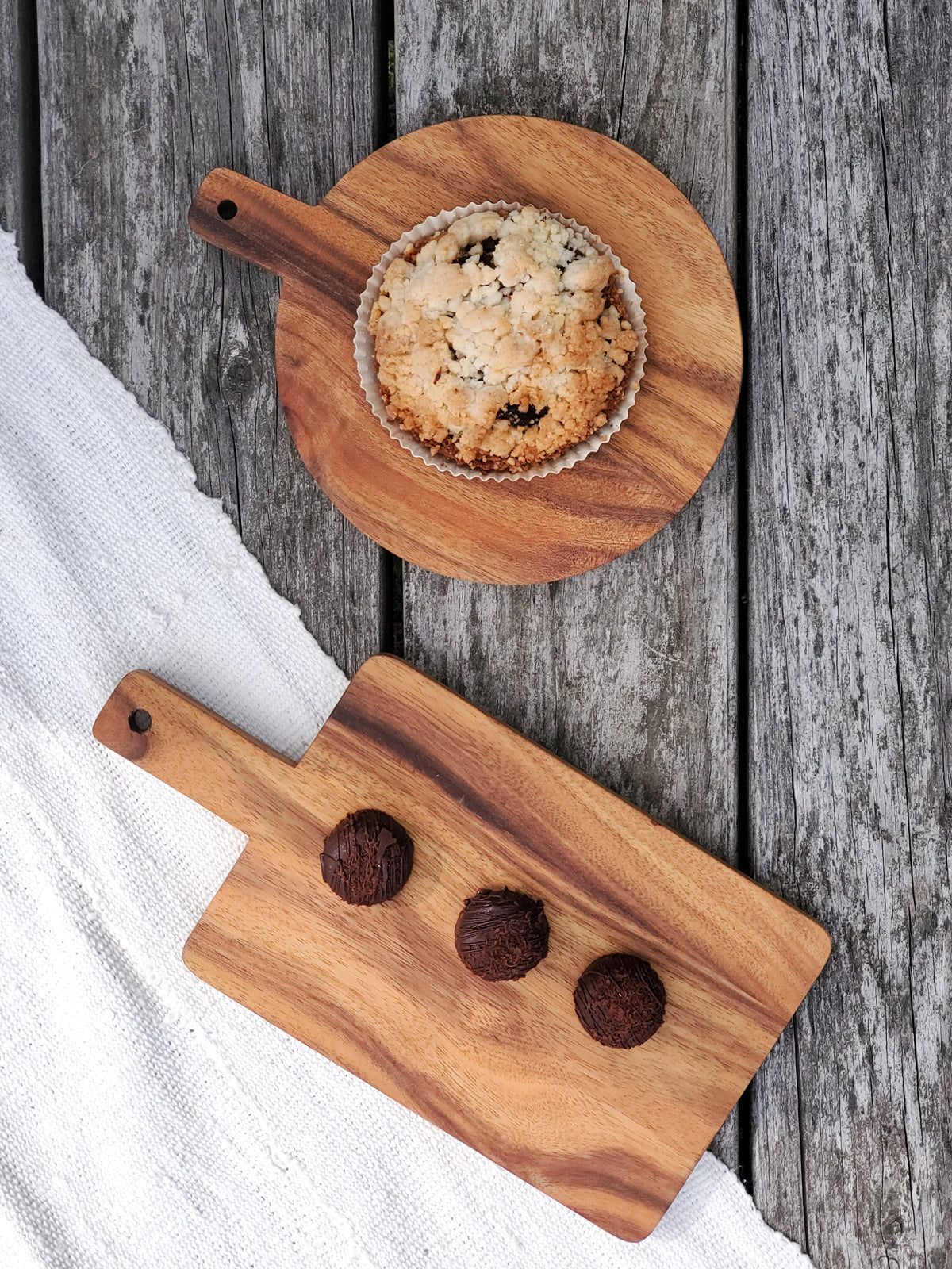 Korissa Wooden Serving Board with tart, on linen and weathered wood