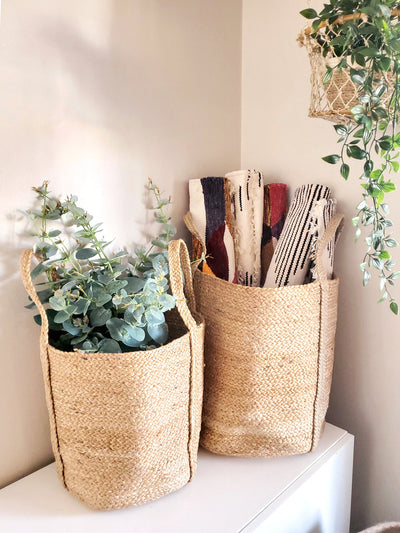 Korissa Kata Basket with Handle holding plant and table mats, tabletop