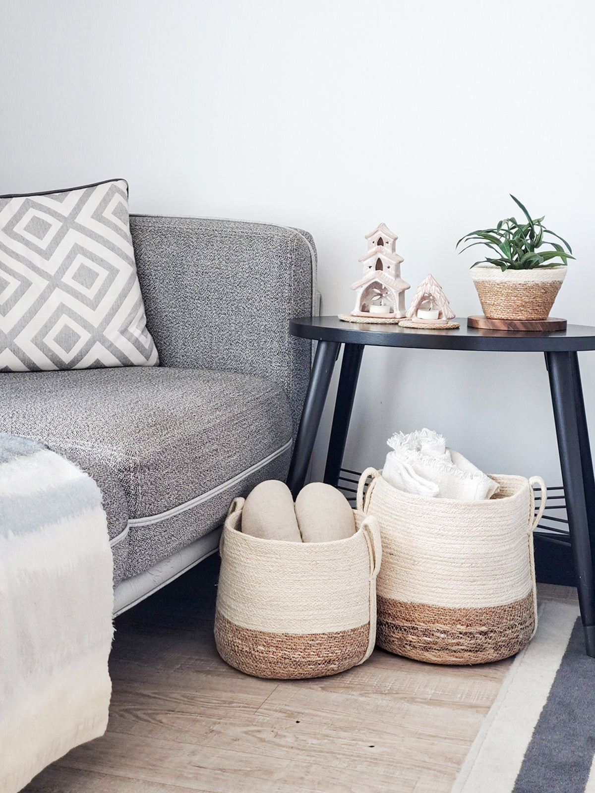 Korissa Savar Basket with Side Handle styled in living room with towels