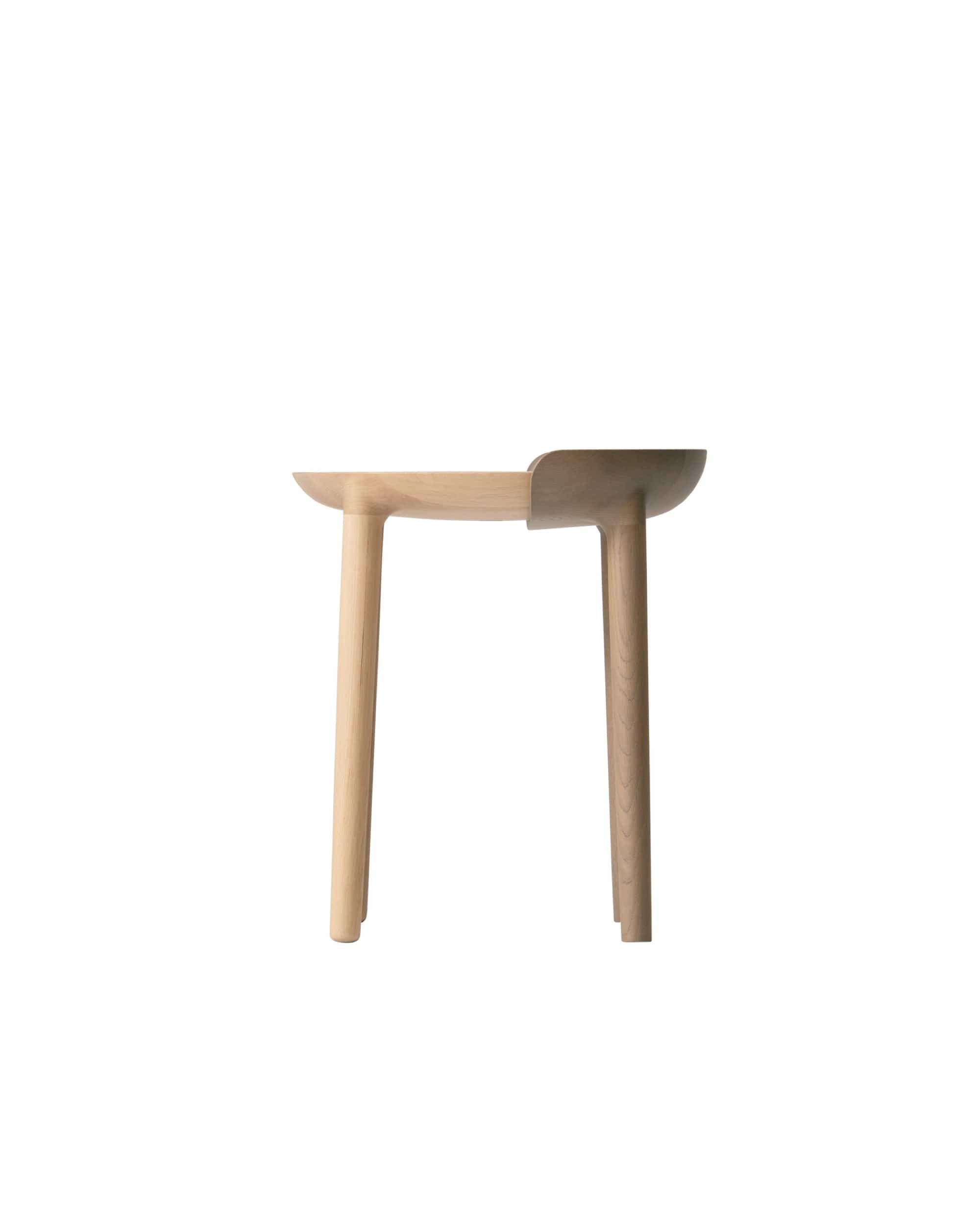 Side profile of CRUST Stool with sculpted wooden seat and clean modern silhouette — Japanese craftsmanship.