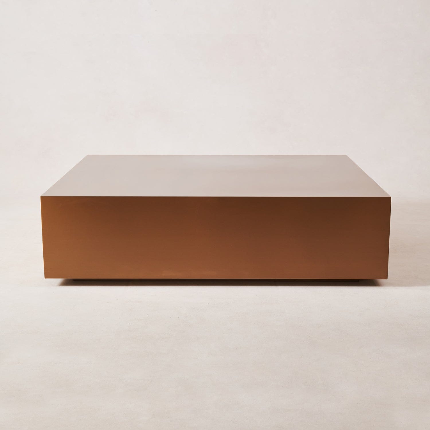 Rectangular copper coffee table with clean lines and brushed finish