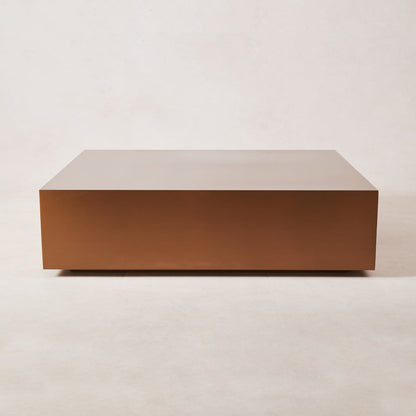 Rectangular copper coffee table with clean lines and brushed finish