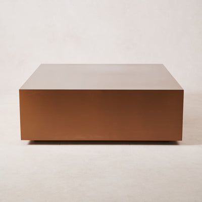 Copper coffee table with brushed copper finish and rectangular form