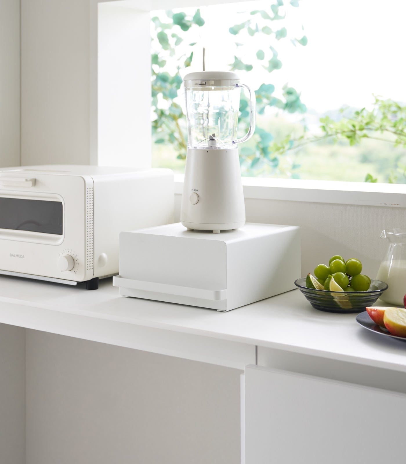 Steel countertop rack with appliance on top creating extra storage space