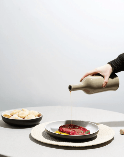 Stoneware Olive Oil Dispenser - Brutto 21 oz in Linen in use