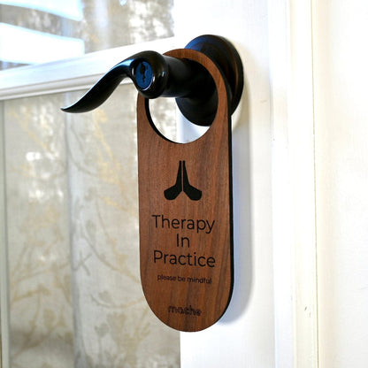 Wooden therapy door hanger sign reading “Therapy in Practice”