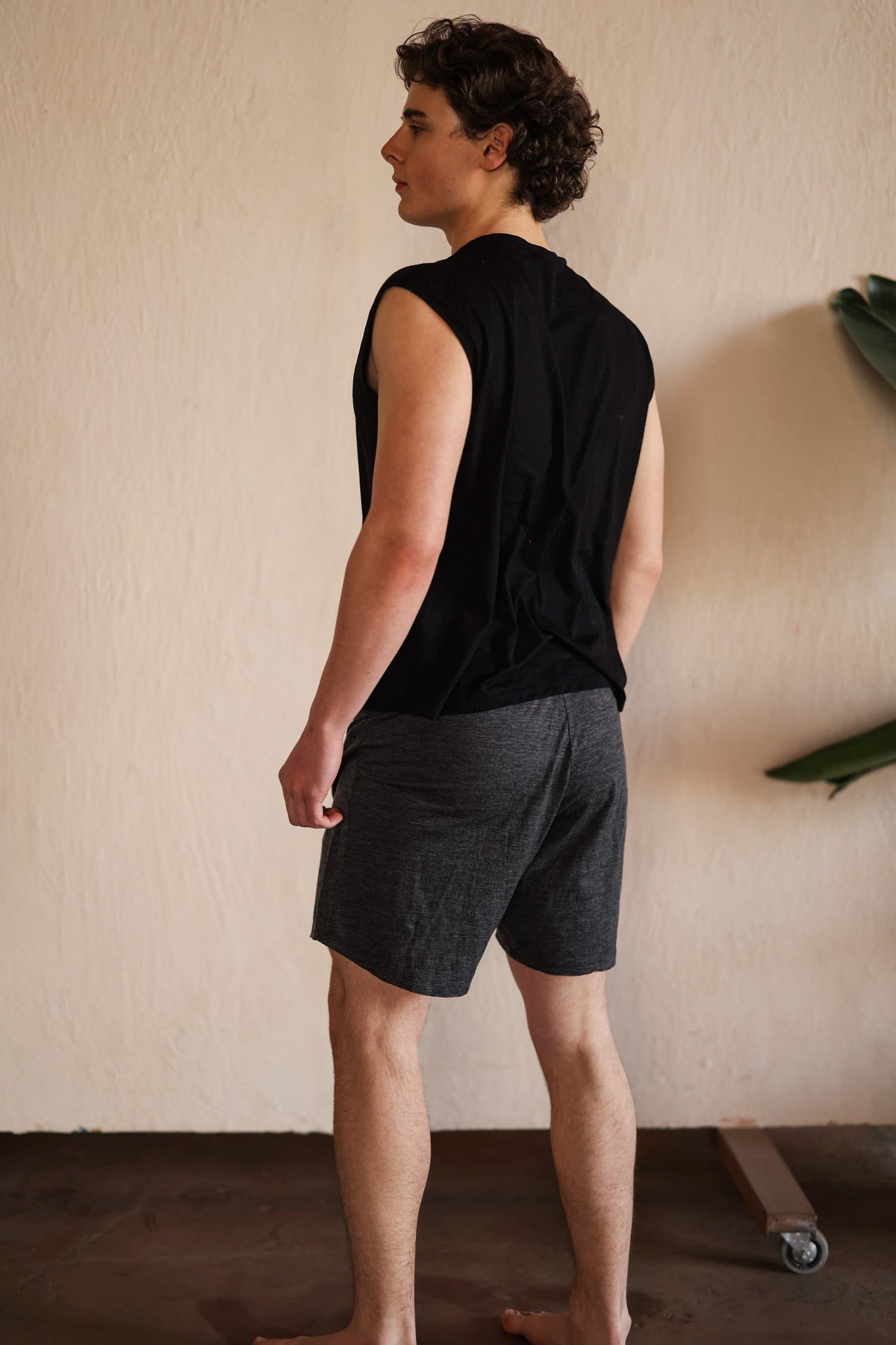 Back view of men's merino wool sauna shorts showing clean minimalist design and relaxed silhouette for sauna and recovery.