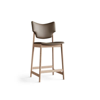 Three-quarter front view of the Eikund Veng Counter Stool, showing the curved taupe-brown back, rounded seat edge, and light wood frame with splayed legs and connecting footrest rails.