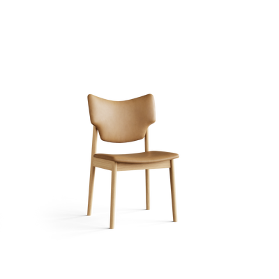 Three-quarter front view of the tan Eikund Veng Dining Chair, showing the backrest’s wrapping curve, rounded seat edge, and armless light wood frame.