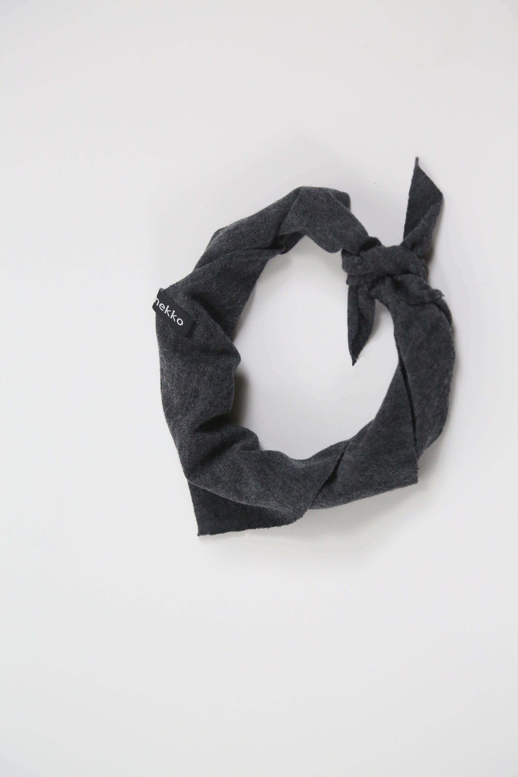 Merino wool bandana in charcoal gray designed for sauna, recovery rituals, travel, and everyday wear.