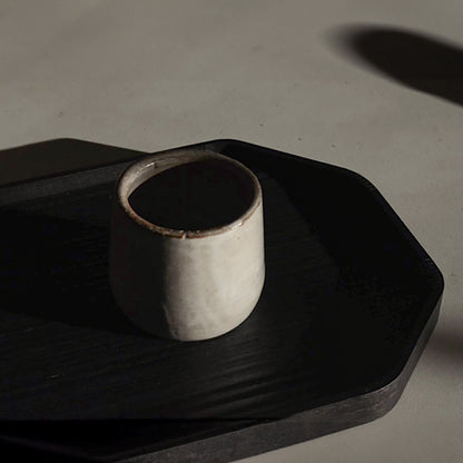 Versatile Sand Ceramic Cup On Black Tray