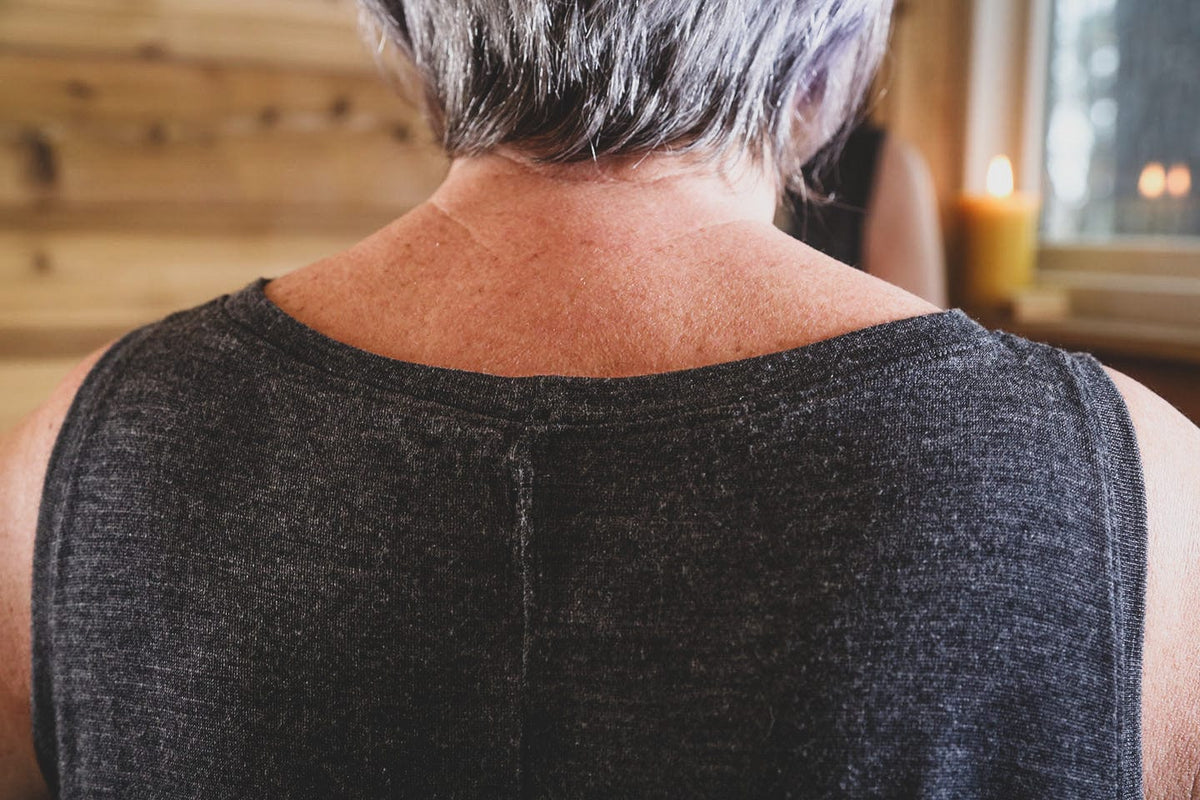 Close-up detail of merino wool sauna dress fabric showing soft texture, natural drape, and breathable knit construction.