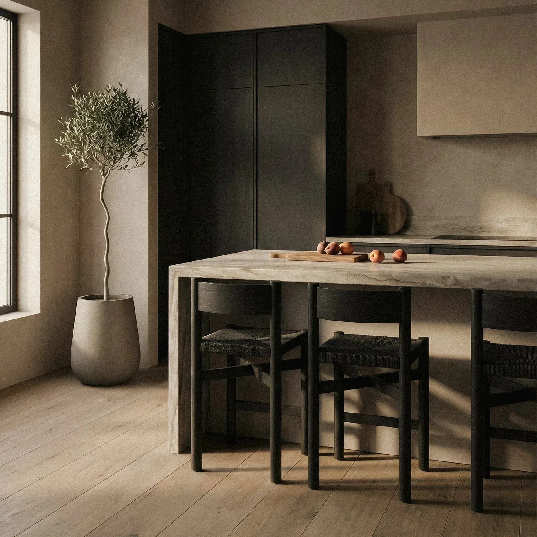 Modern kitchen with wooden table and chairs, large window, and potted plant showcasing the Nonna Counter Stool by House of Leon