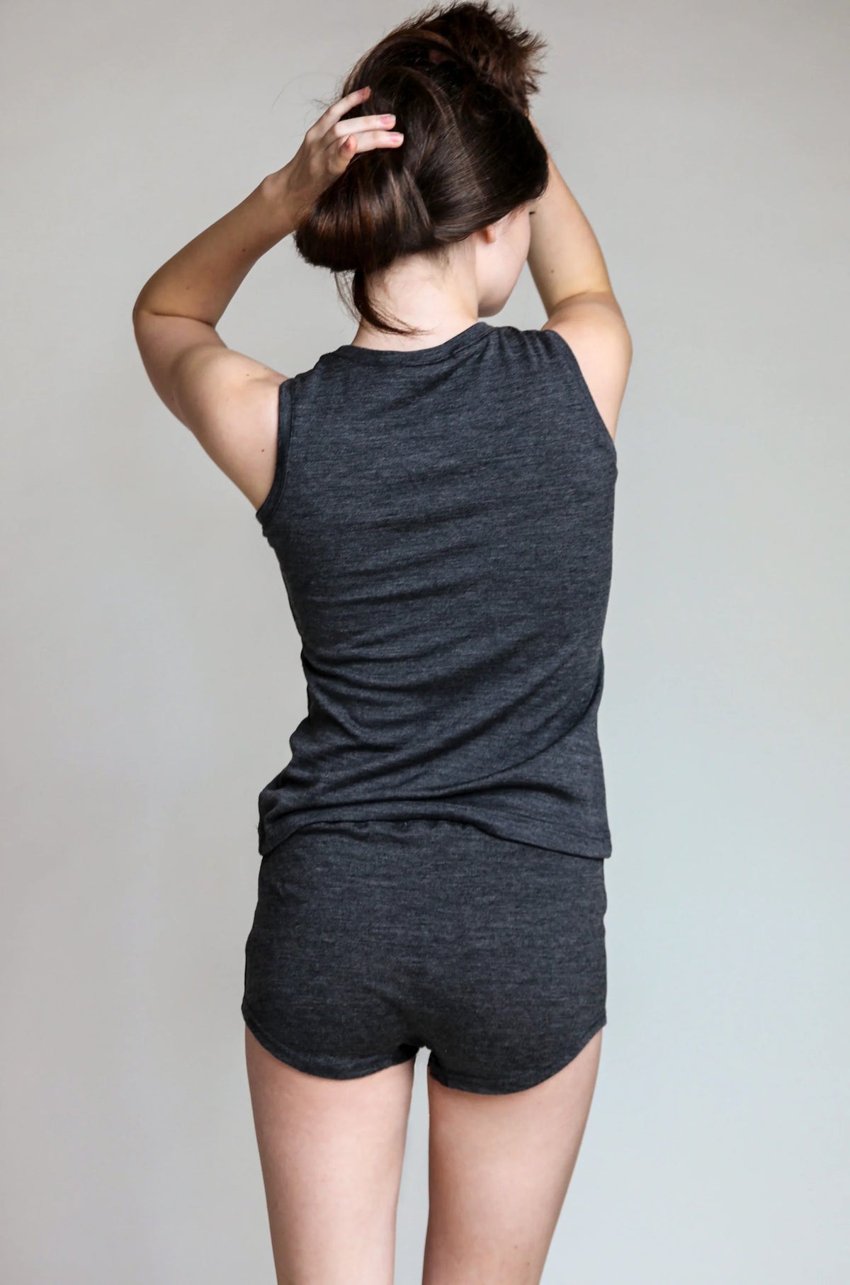 Back view of a merino wool sauna tank showcasing clean lines, unrestricted movement, and lightweight comfort.