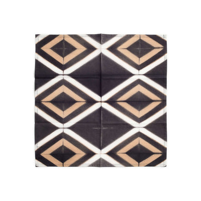Flat front view of the black napkin with repeating cream and tan geometric diamonds.