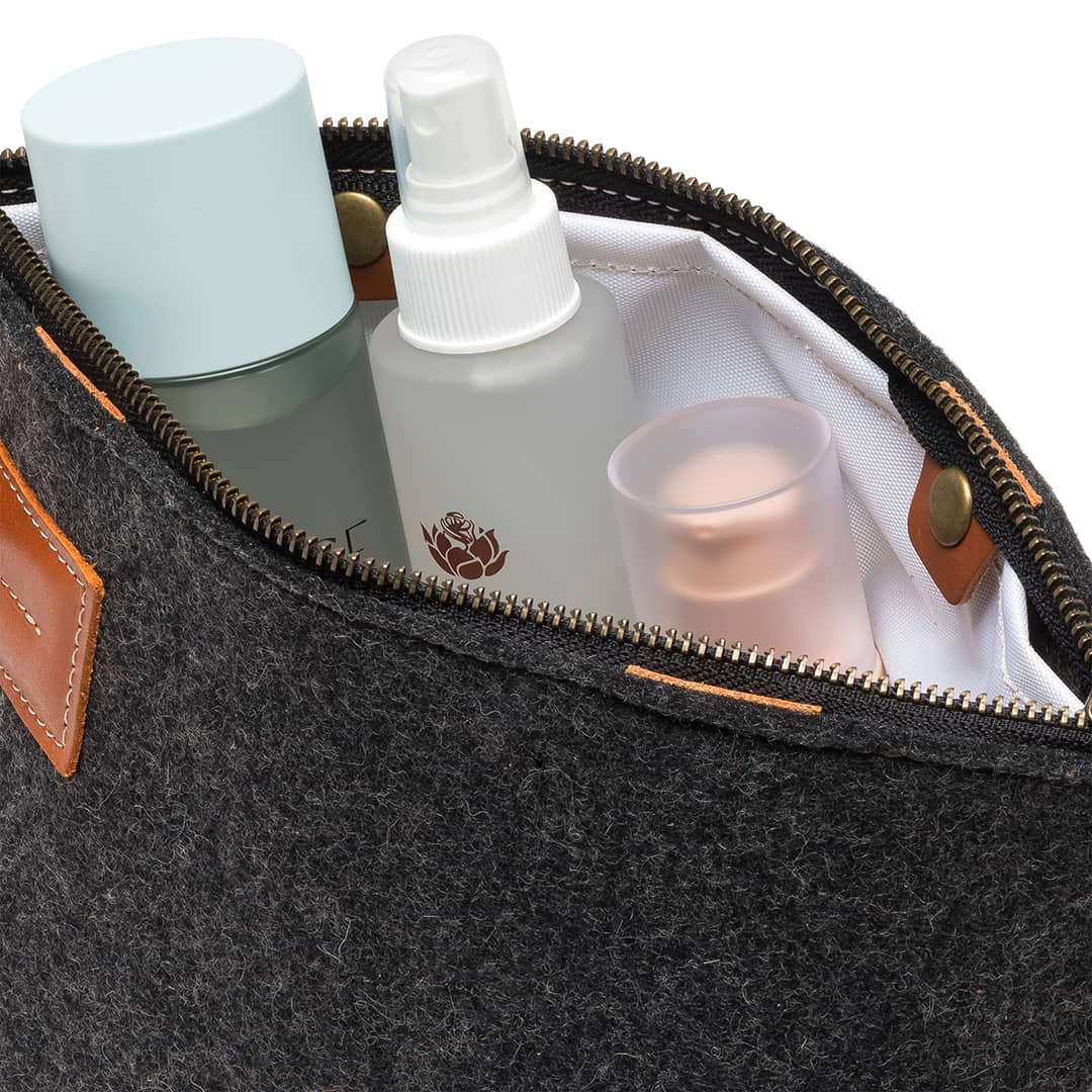 Kyrgies Felt and Leather Travel Kit, charcoal wool felt, interior view with toiletries