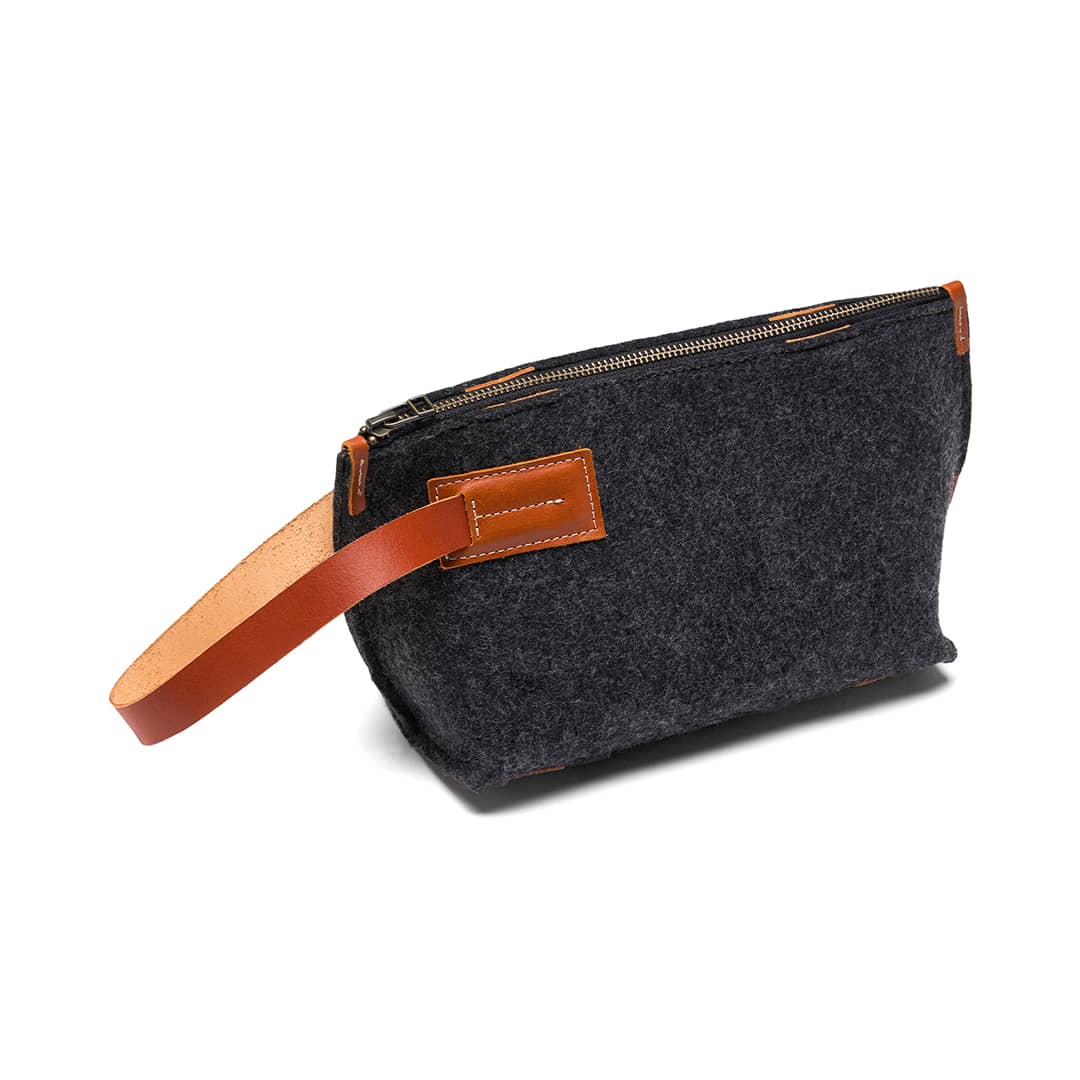 Kyrgies Felt and Leather Travel Kit, charcoal wool felt, side view with leather handle
