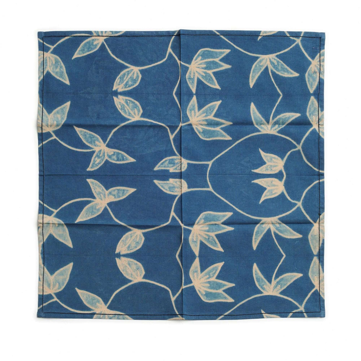 Blue color variation of the Folio handcrafted shibori cotton napkins with cream botanical leaves and stems