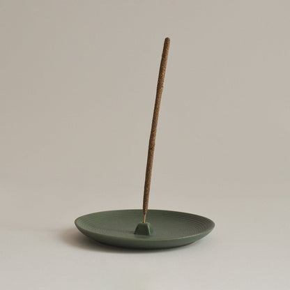 Green Ceramic Incense Holder Plate on beige background