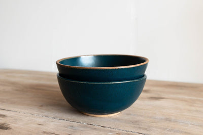 handmade ceramic cereal bowl on wood table