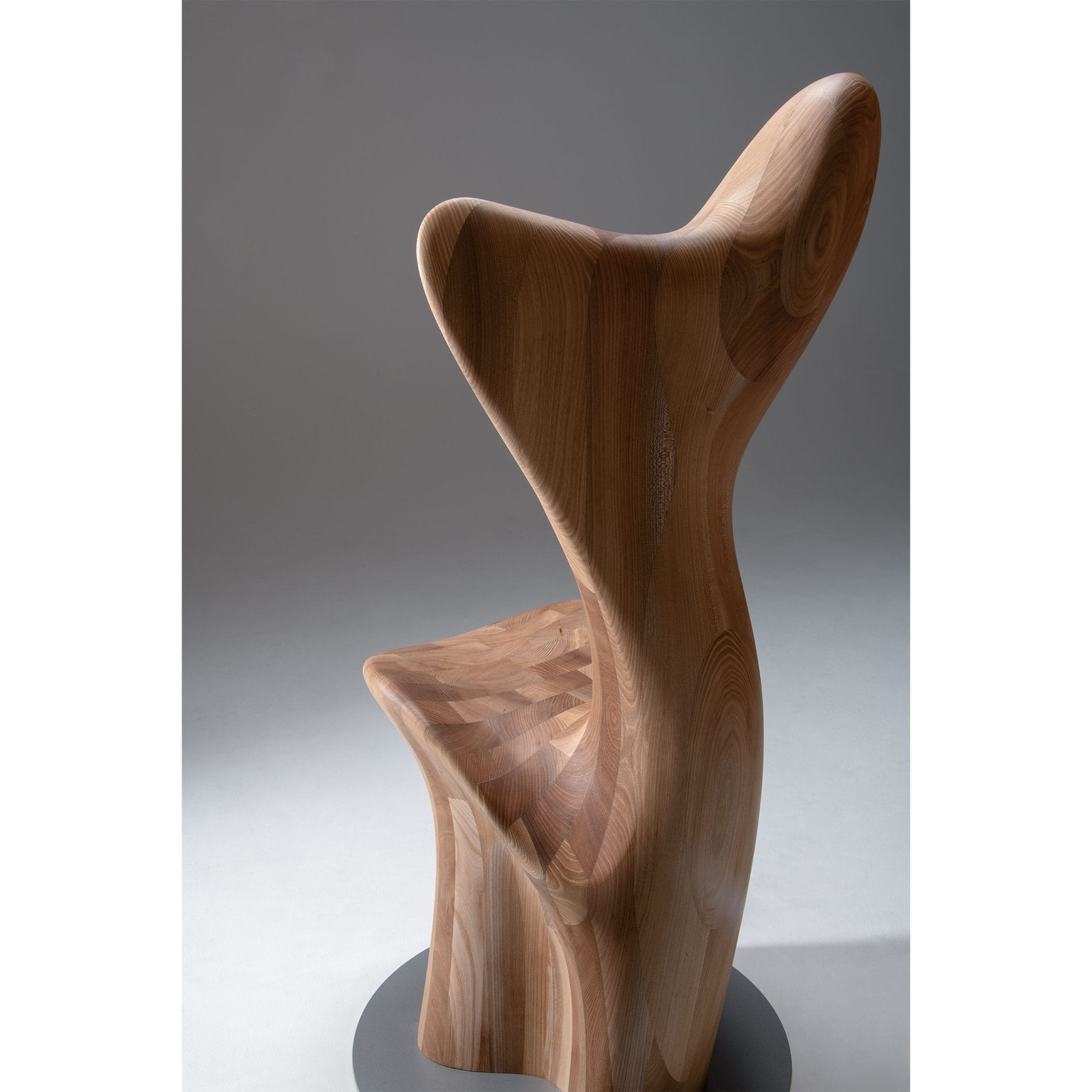 Full back view of HUG Chair by CondeHouse with flowing wood form