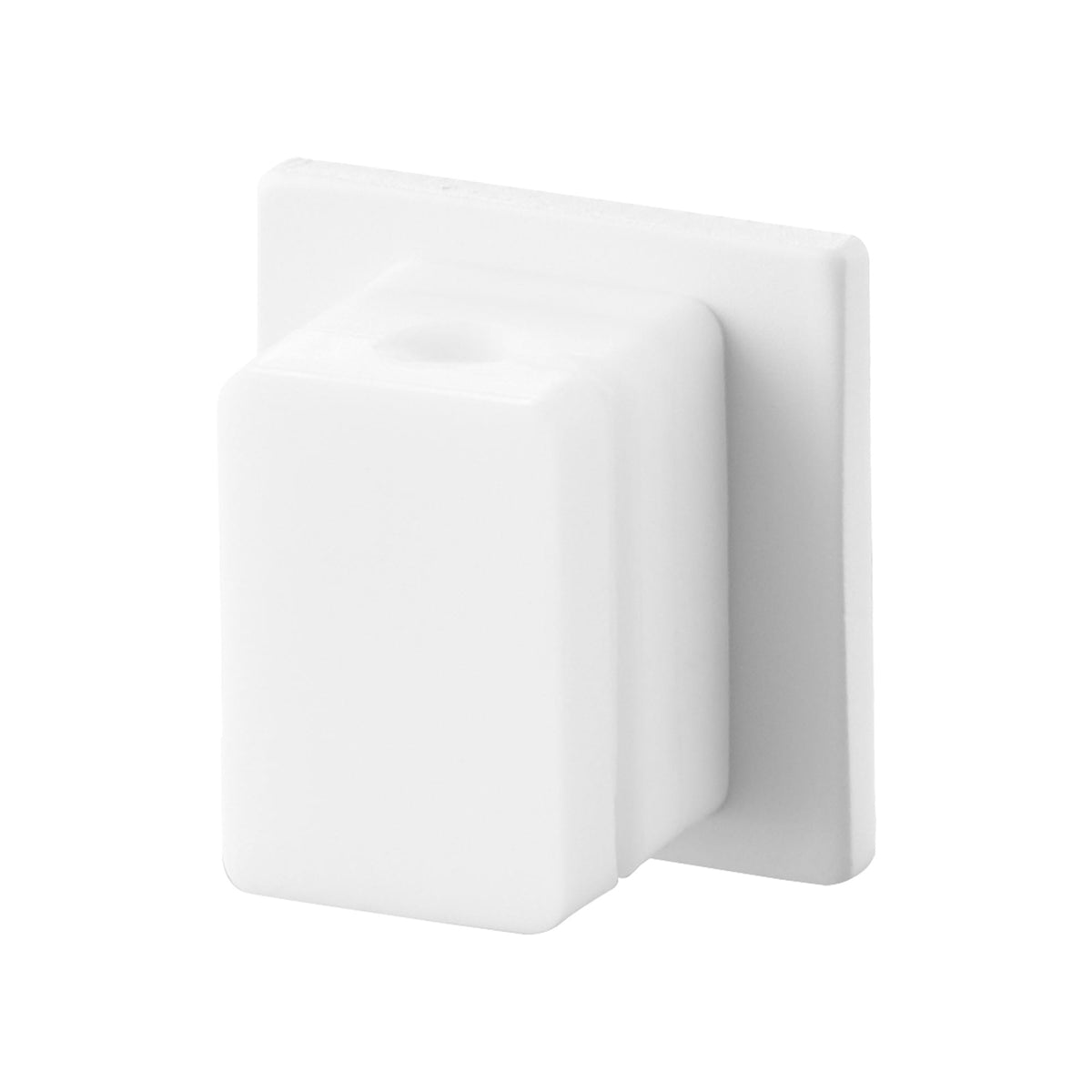 White Yamazaki Home Magnetic Cable Holder With Adhesive Steel Base - Silicone isolated at an angle, showing its compact rectangular body, round cable opening and flat square backing plate.
