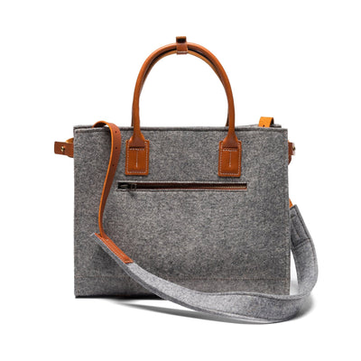 Kyrgies Handmade Wool Handbag, grey wool felt, front view with leather handles and crossbody strap