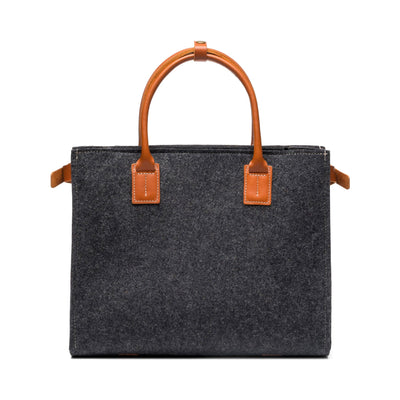 Kyrgies Handmade Wool Handbag, charcoal wool felt, side view with leather handles and crossbody strap