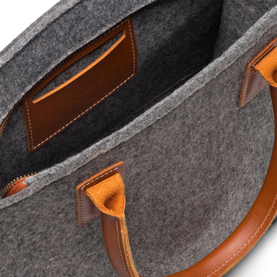 Kyrgies Handmade Wool Handbag, charcoal wool felt, close-up interior view showing leather trim pocket
