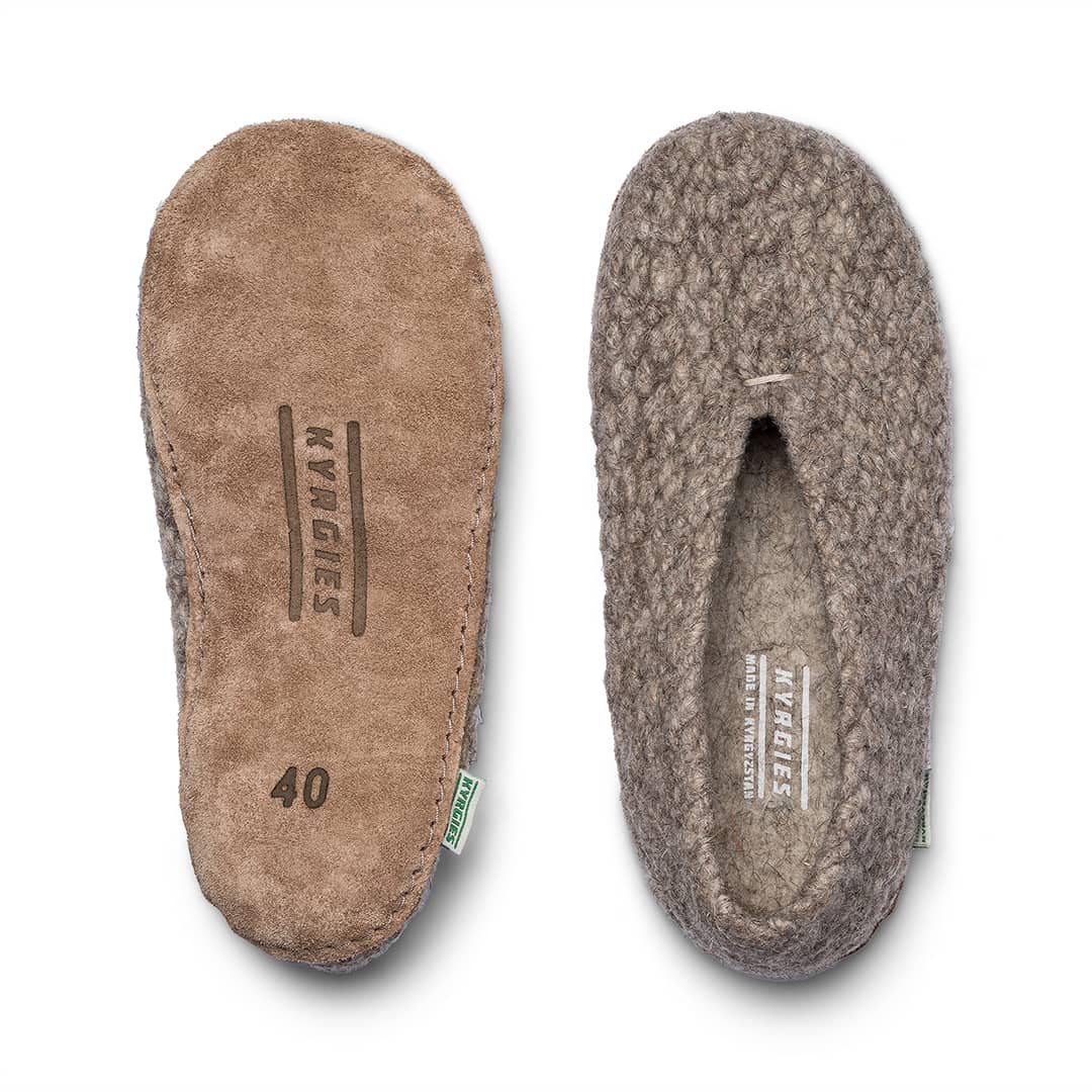 Pair of brown slippers with brand logo on a white background