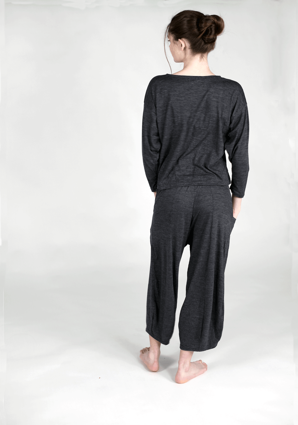 Back view of a merino wool lounge top showcasing minimalist design, easy drape, and everyday versatility.