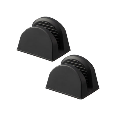 Two black Yamazaki Home Magnetic Pot Holders - Set of 2 - Silicone on white, viewed at an angle to show their arched bodies, flat bases and ribbed inner gripping surfaces.