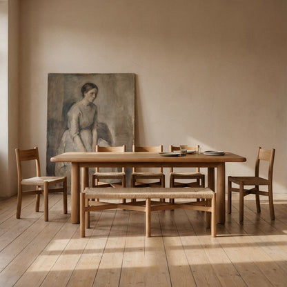 Nonna bench paired with solid wood dining table in warm dining space