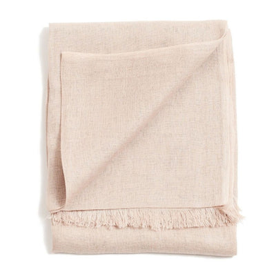 Folded blush-pink color variation of the Variously handwoven scarf with a delicate weave and short fringe
