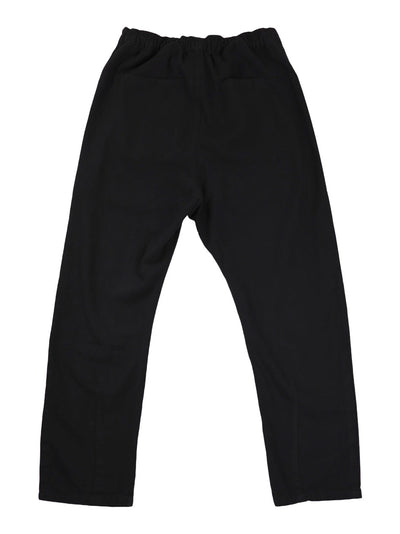 Back product view of black Canvas Souk pants with an elastic waistband.