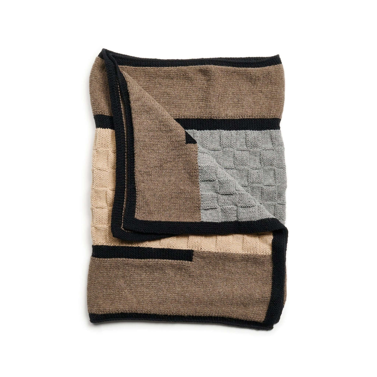 Neatly folded blanket displaying its brown, gray, beige, and black geometric panels.