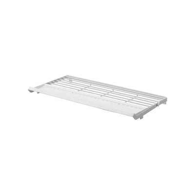 White Yamazaki Home Slim Over-the-Sink Dish Drying Rack - Steel shown empty with its support rail folded flat, revealing its low rectangular profile and slatted construction.