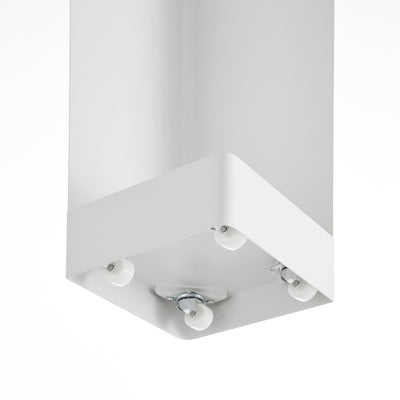Underside view of the white Yamazaki Home Rolling Bathroom Organizer - Steel, showing small caster wheels beneath its square base.