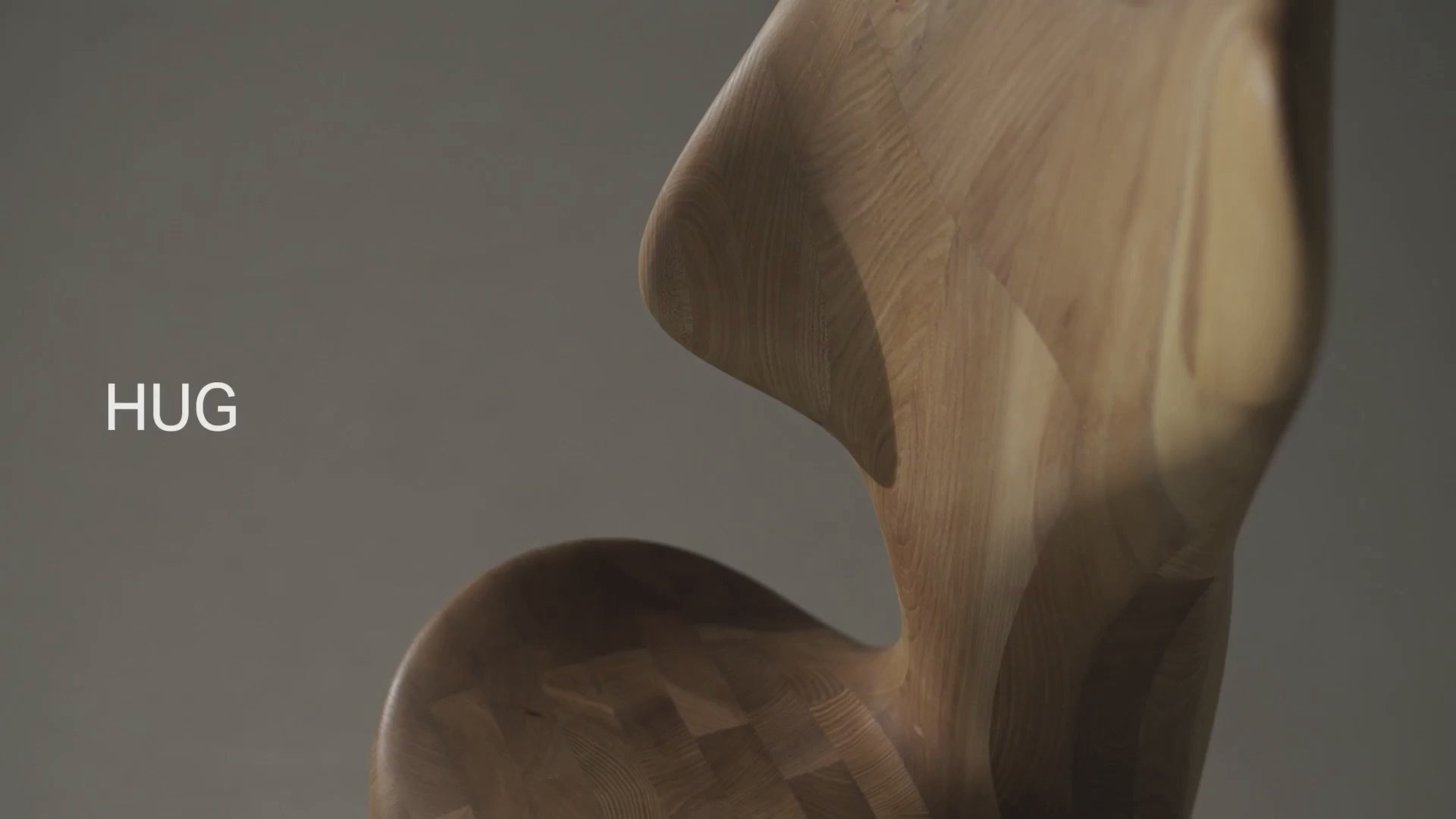 Load video: Japandi HUG Chair rotation with close-up details of sculptural solid wood design and handcrafted curves by CondeHouse