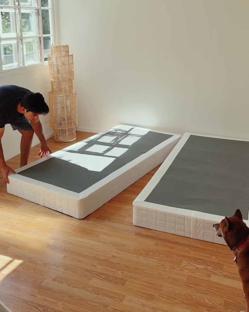 Load video: Easy installation of SoftFrame upholstered bed frame placed over a box spring without tools