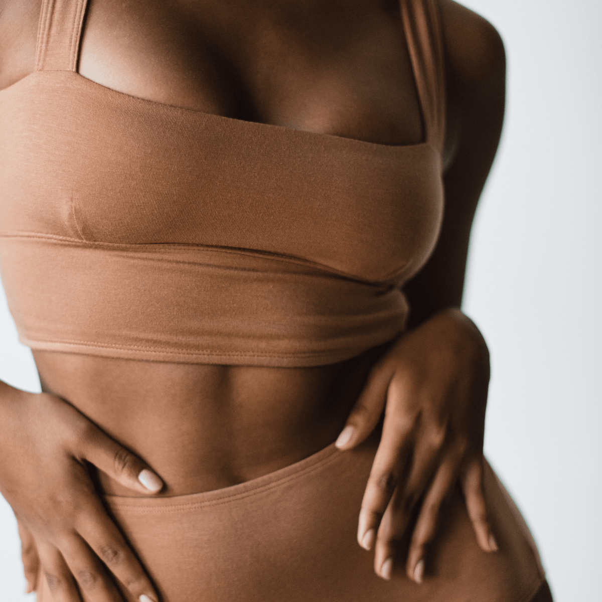Model wearing PROCLAIM Organic Cotton Square Neck Bralette in Maya Nude, close-up front view