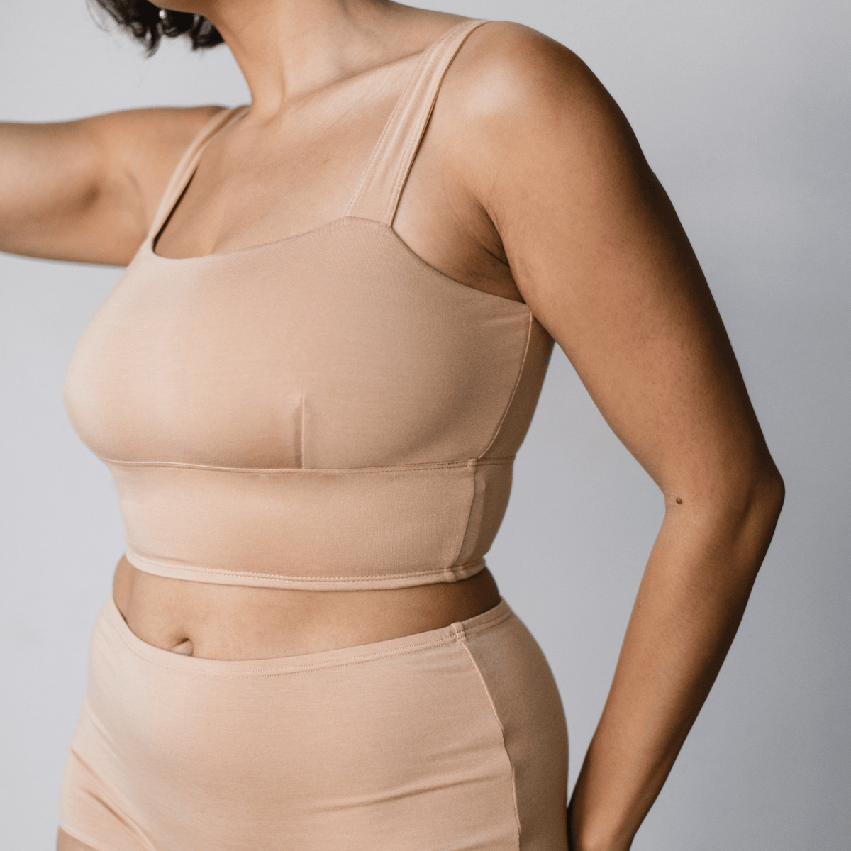 Model wearing PROCLAIM Organic Cotton Square Neck Bralette in Ada Nude, close-up front view