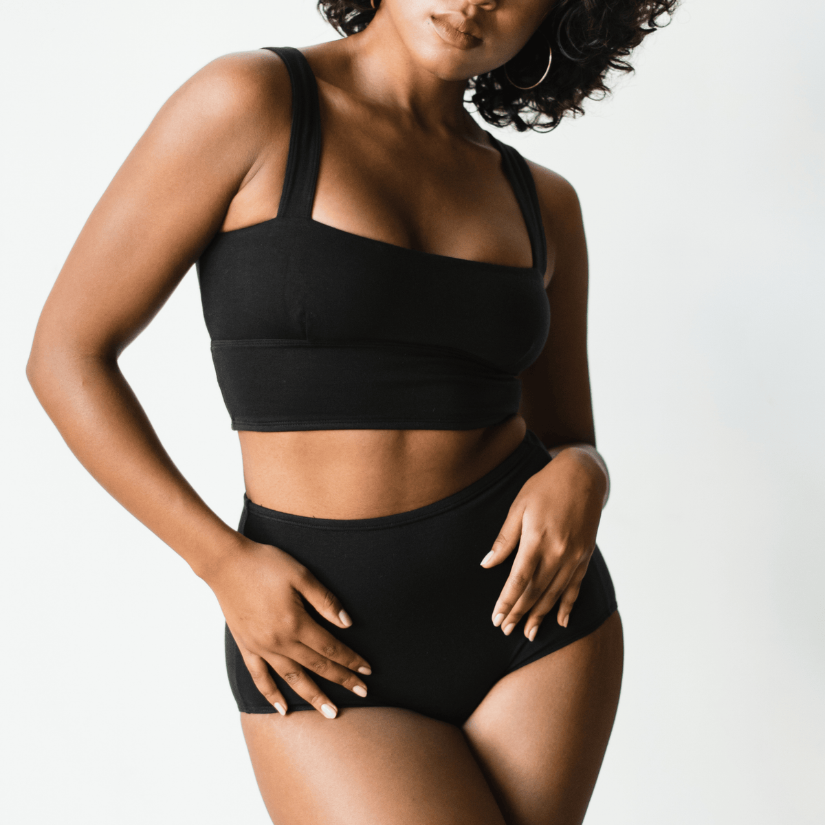 Model wearing PROCLAIM Organic Cotton Square Neck Bralette in Black, front view
