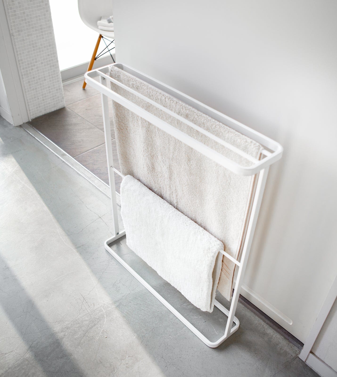 White towel rack with towels in a bathroom setting. Bath Towel Hanger (30" H)  - Steel