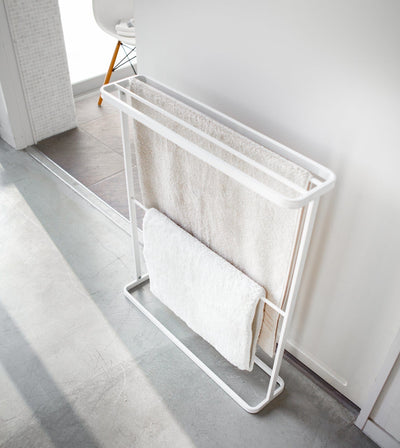 White towel rack with towels in a bathroom setting. Bath Towel Hanger (30" H)  - Steel