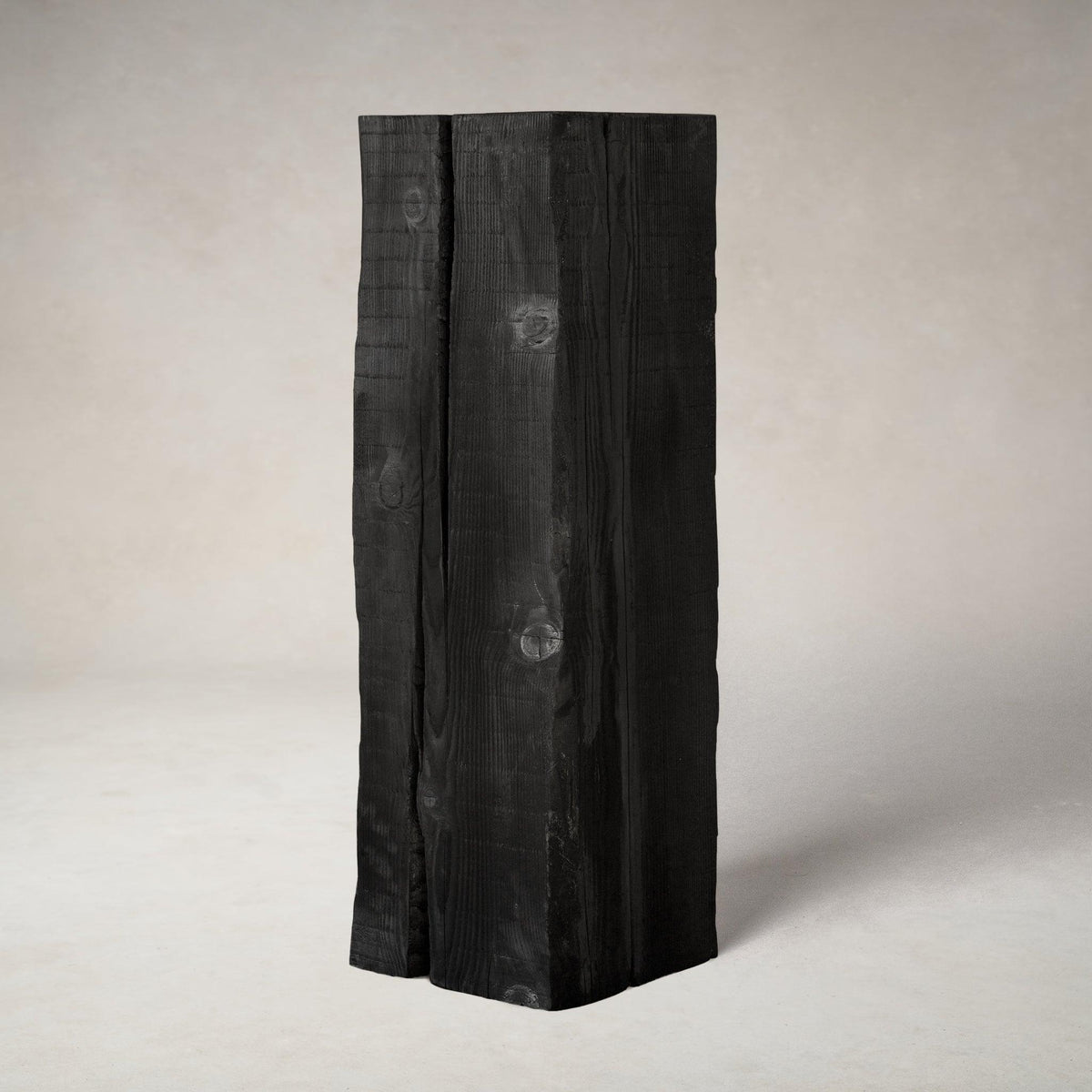 Charcoal sculpture pedestal in shou sugi ban Douglas fir, studio front view
