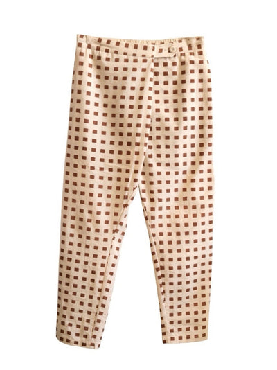 Front product view of cream Souk pants with rust-red hand-block-printed squares.
