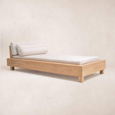 Single sized Ojai Outdoor Daybed with a teak wood frame and white cushions, positioned on a plain background.