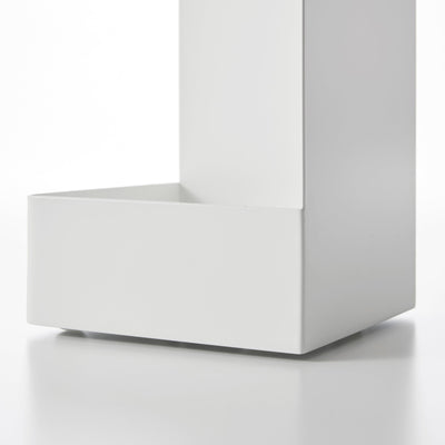 Close-up of the white Yamazaki Home Rolling Bathroom Organizer - Steel base, showing the deep rectangular lower tray, raised front edge and tall solid side panel.
