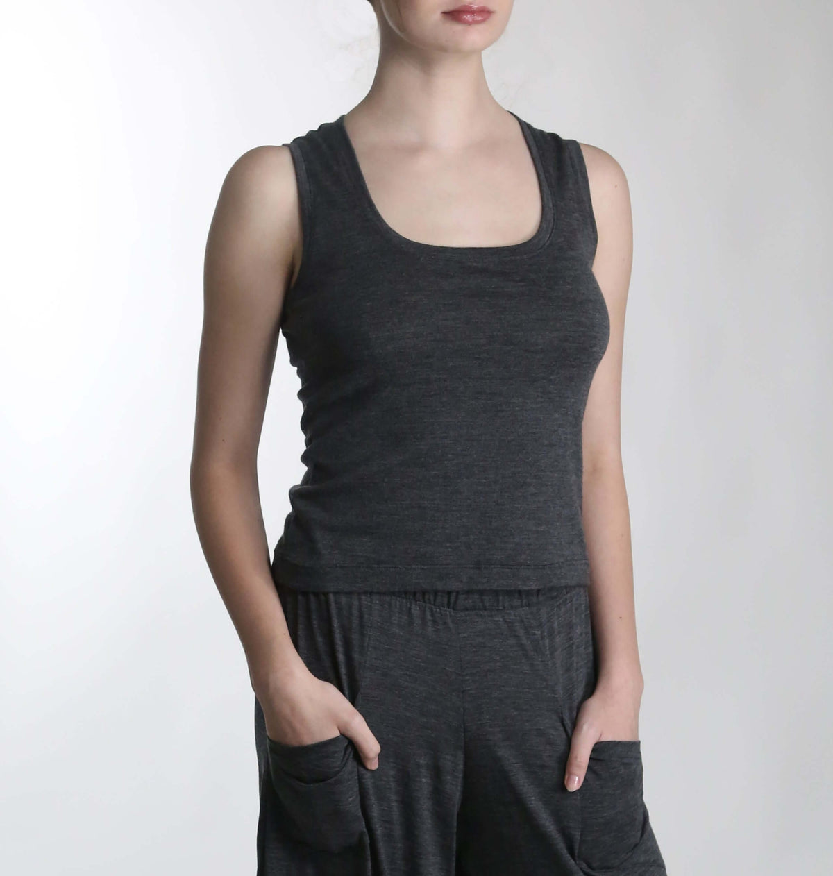 Front view of a charcoal merino wool sauna tank featuring a minimalist silhouette and breathable natural wool construction.